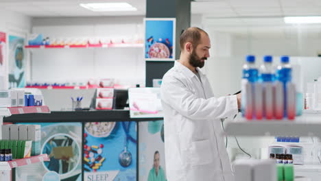 pharmacist scanning medical products boxes in healthcare store