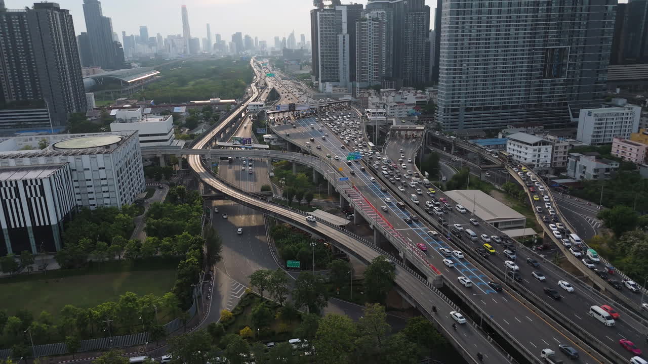 Aerial View Of Cars Driving Through The Sirat Expressway Along The High-rise Buildings In Bangkok, Thailand