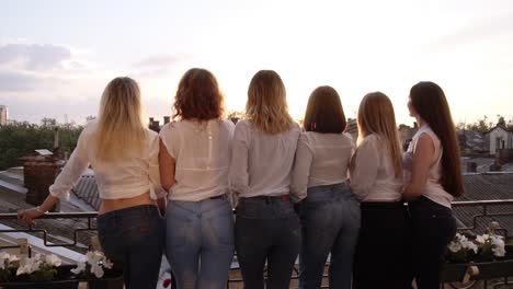 Six-Seductive-Young-Women-Are-Standing-On-A-Terrace-In-A-Row-From-Their-Back