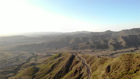 aerial footage over ethiopia mountain ridge with dirt road