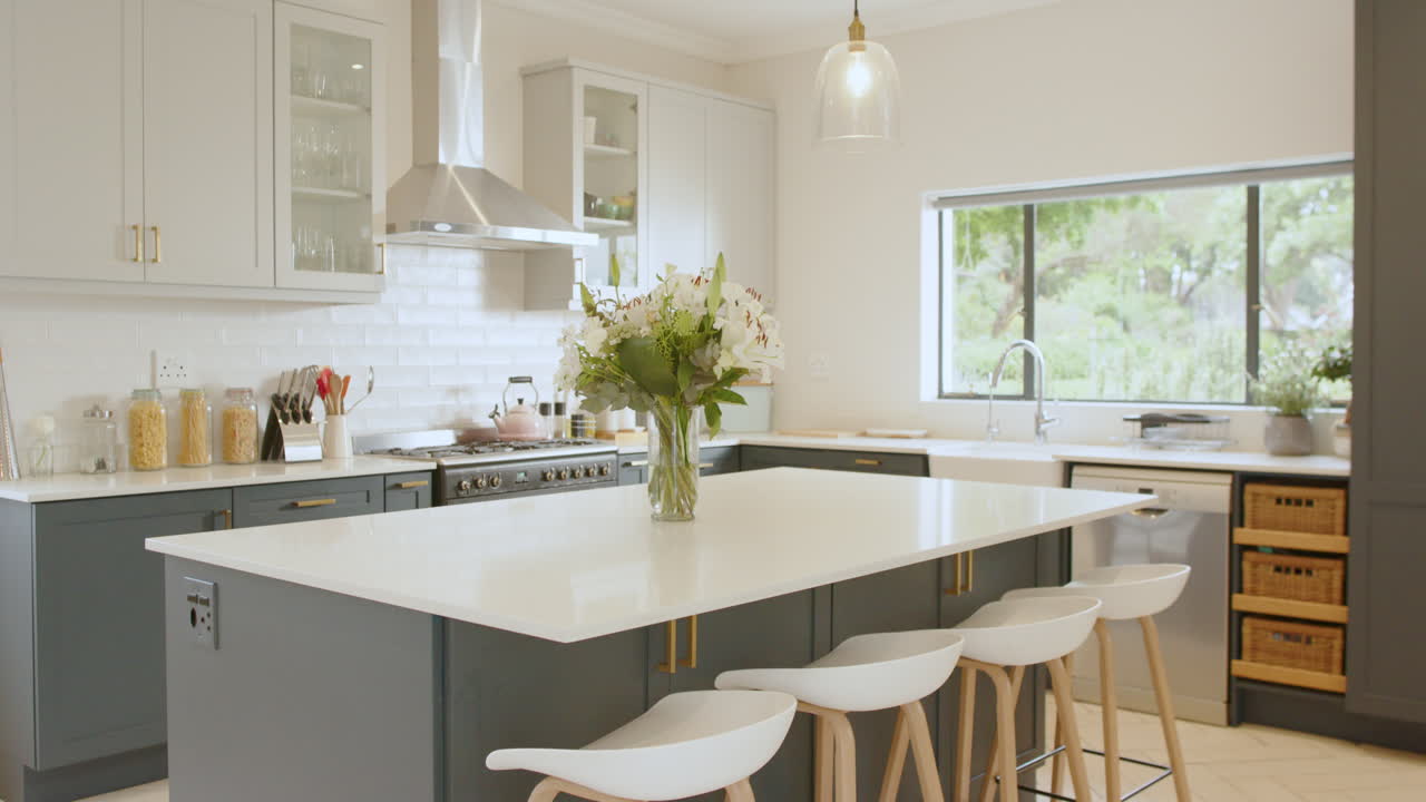 Modern kitchen with elegant island and fresh flowers, bright and inviting space, at home