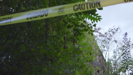 a black police officer stringing caution tape