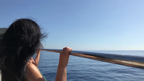 Woman-on-a-boat-sailing-through-the-Mediterranean-Sea,-along-the-coast-of-Palma-de-Mallorca