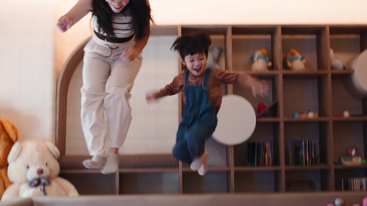Mother and Son Playing Together in a Ball Pit