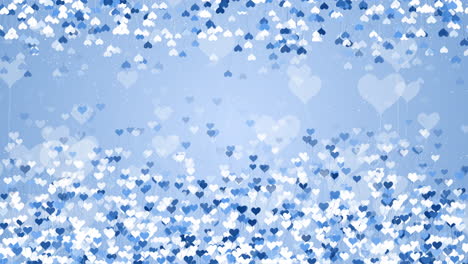 flying small balls in the shape of hearts. scattered blue confetti. festive animation frame. copy space. looped motion graphics.