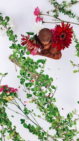 buddha statue with floral arrangement