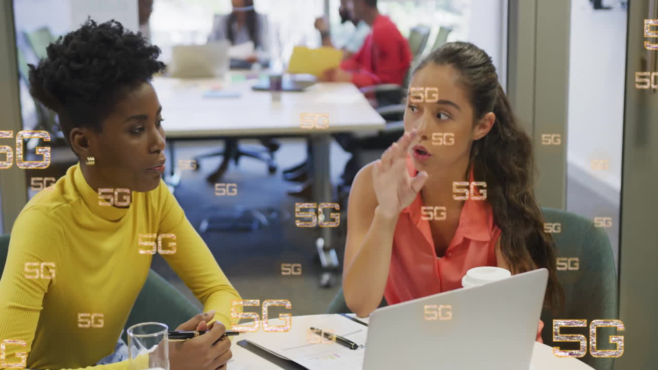 Animation of 5g over diverse colleagues discussing work in office