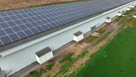 chicken house poultry barn with solar panel array on rooftop in usa