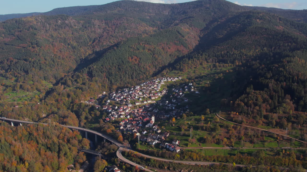 Aerial view of the village of Langenbrand, Forbach, in autumn in the Murgtal region of the Black Forest, highway and bridge in the background
