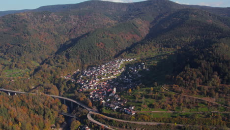 Aerial view of the village of Langenbrand, Forbach, in autumn in the Murgtal region of the Black Forest, highway and bridge in the background