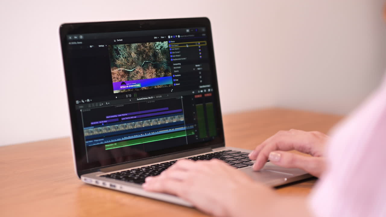 Young content creator girl editing video on her laptop. Working from home