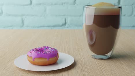 una deliciosa rosquilla con glaseado rosado y salpicaduras coloridas y una taza de café con espuma sobre un fondo de mesa de madera.