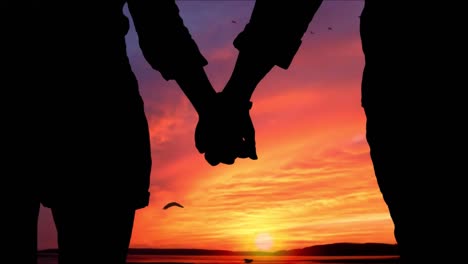 Animated-silhouette-of-couple-holding-hands-while-watching-the-sunset