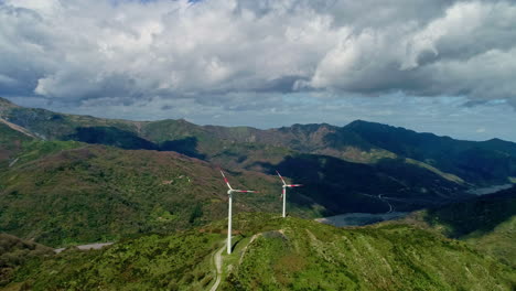 strategically placed wind turbines on mountain ridge, sicily