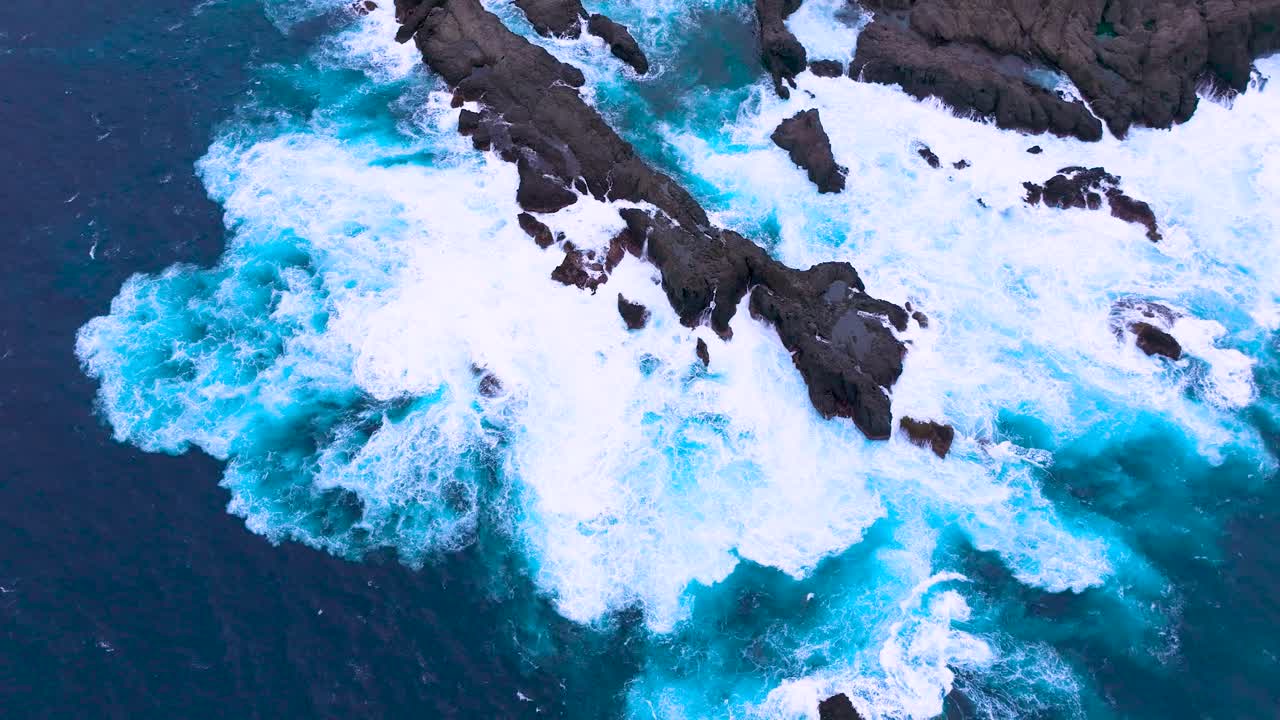 Choppy seas crash on Tenerife's volcanic coast at Charco del Viento
