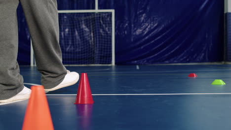 man putting objects on the floor