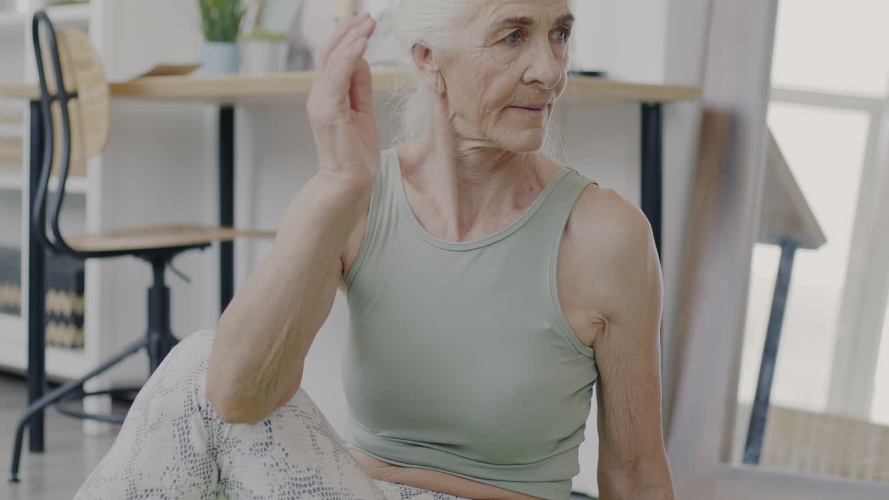 Senior Woman Practicing Yoga at Home