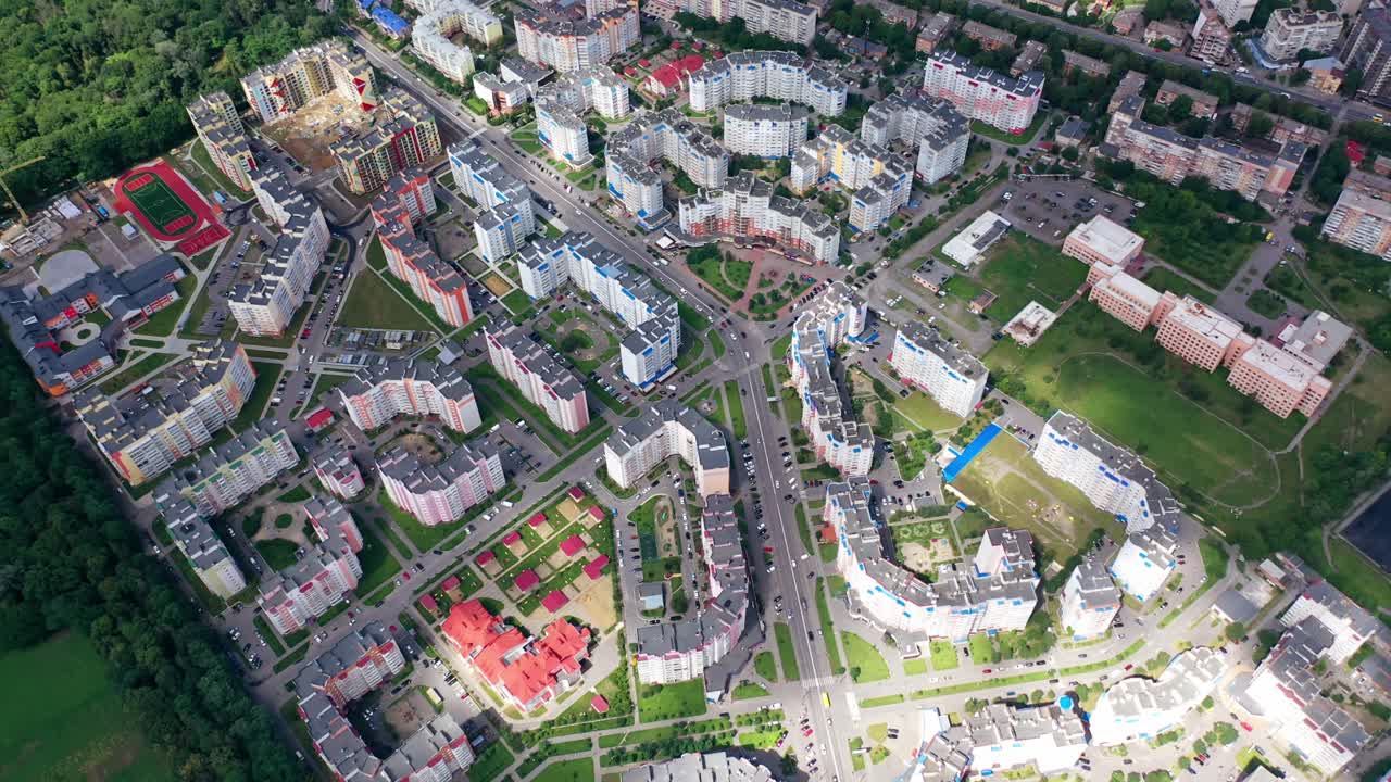 Buildings blocks from the high. Aerial top down view of new estate with neighborhood faculties