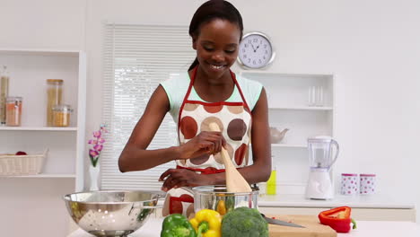 woman is cooking in the kitchen