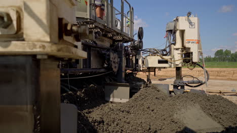 Industrial-machine-producing-massive-amount-of-concrete,-fusion-time-lapse