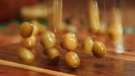 green olives on wooden cutting board