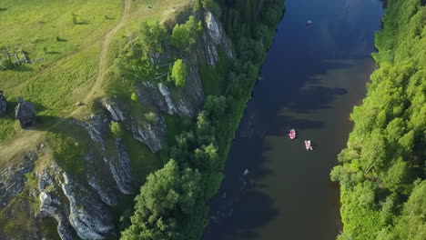 aerial view of river and rural landscape with rafting