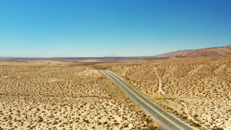 lonely highway 14 or midland trail cuts through the center of the mojave desert's vast landscape