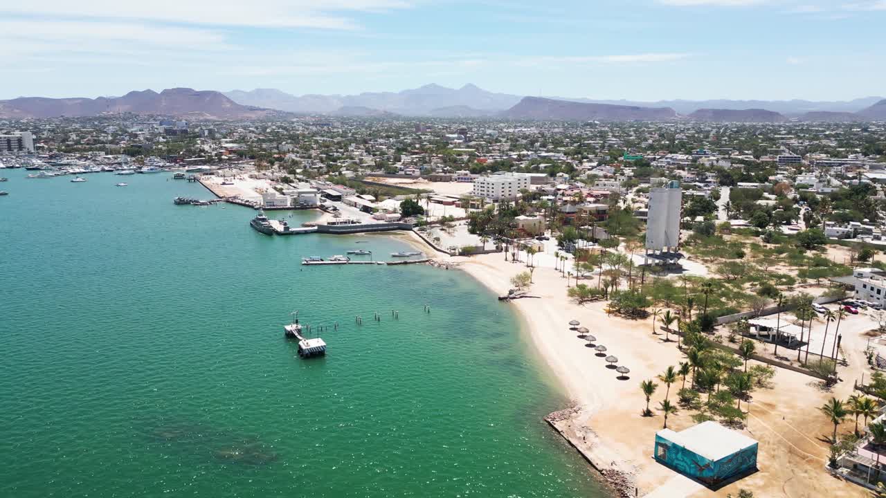 Seaside view with boats and city skyline in La Paz, Playa Posada, Baja California Sur