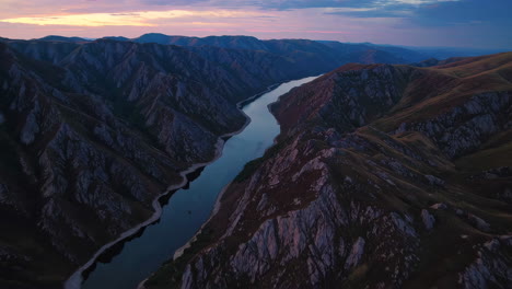 mountainous river valley at sunset