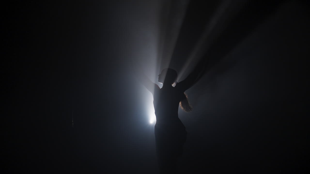 Silhouette Dancer in Smoky Studio