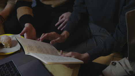 businessmen hands checking notes in notebook