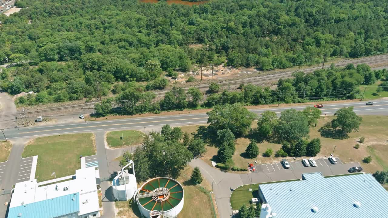 Panoramic aerial view of purification tanks of modern wastewater treatment plant on water recycling station