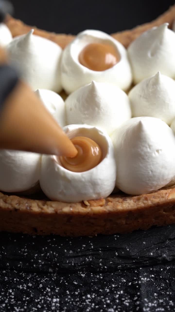 A skilled chef adding smooth caramel sauce to a delicious cake, close up shot, insert shot