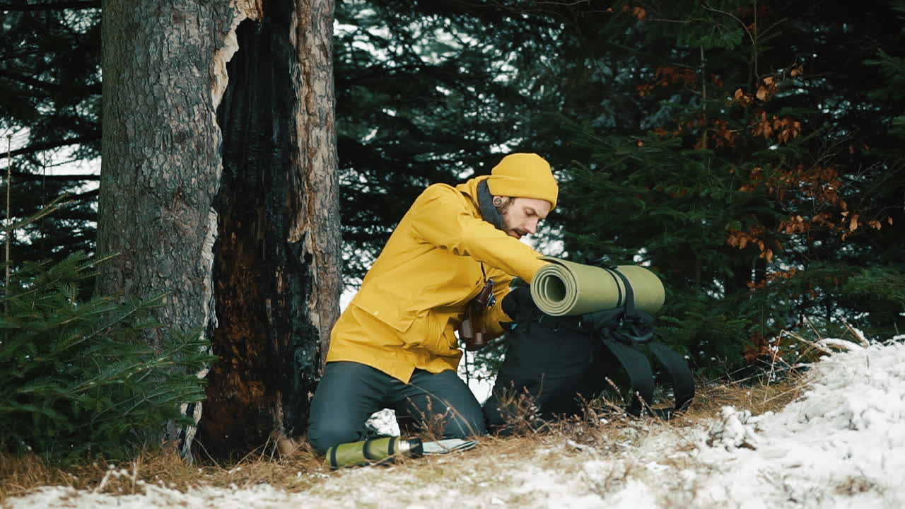 Hiker with Backpack in Snowy Woods