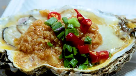 delicious grilled oyster with vibrant toppings