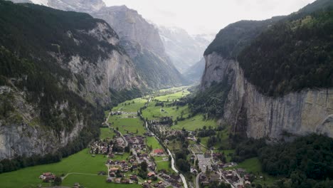 lauterbrunnen valley nestled between towering cliffs, aerial view