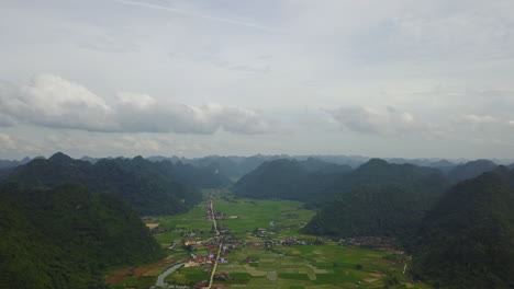 aerial view of bac son valley's lush fields and surrounding mountains
