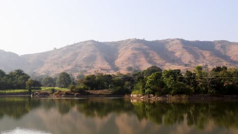 isolated pristine lake with water reflection at morning from flat angle