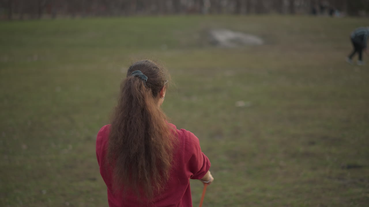 Participant Stretches With Resistance Band, Person Exercises Outdoors During Peaceful Evening, Participant Engages In Warmup Exercises With Resistance Tools Outdoors During Calm Evening Hours