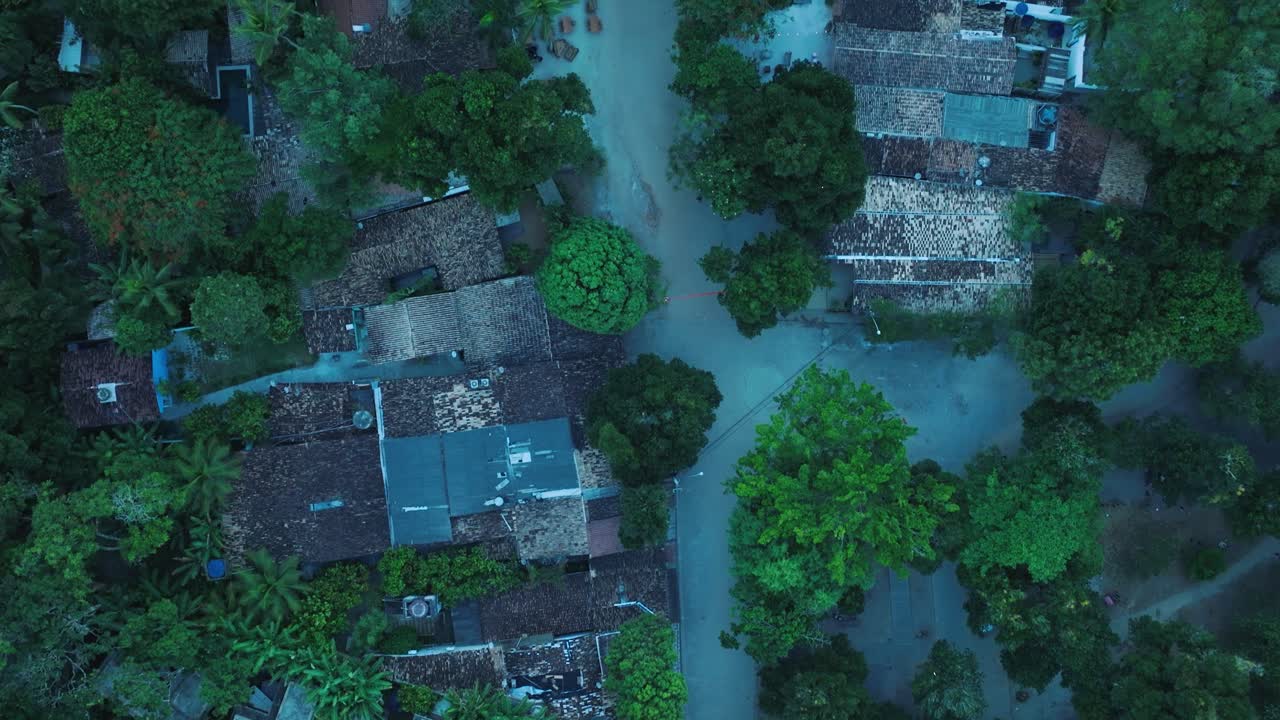 Aerial Top-Down Drone View of beach town Trancoso in Bahia Brazil with rooftops and trees