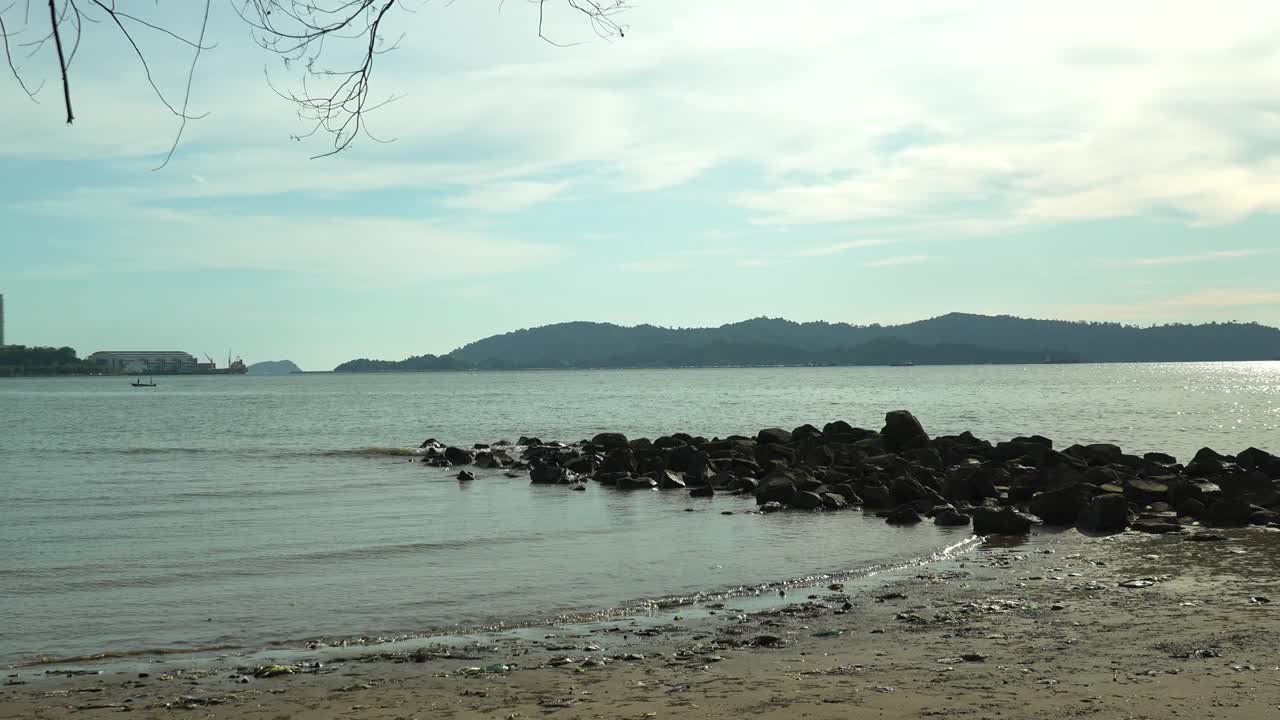 Summer Beautiful View Of Teluk Likas Beach, White Sandy Beach, Small Island, Blue sea water And Green Trees,Kota Kinabalu,Sabah,Malaysia.