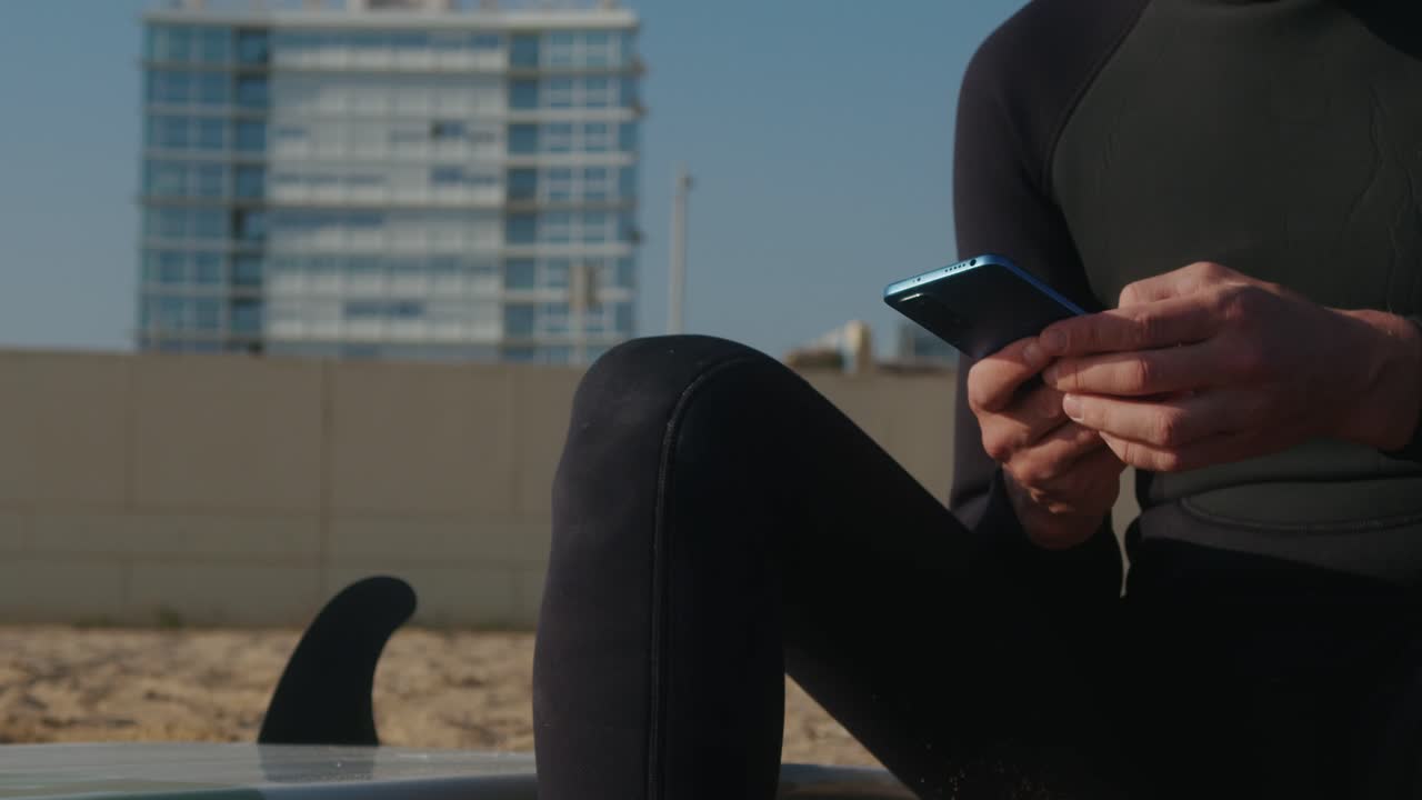 Surfer man walking to the beach at sunset preparing for surfing training and search for waves in Barcelona, spain, water, ocean exercise in sea with board, athletic male holiday or travel in vacation