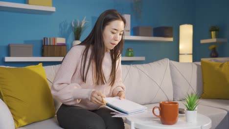 asian young woman working from home is bored.