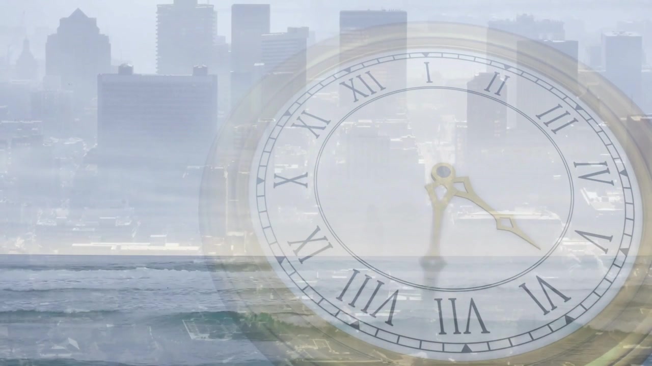 Clock hands moving clockwise and waves rolling and breaking, starting on play to show time passing