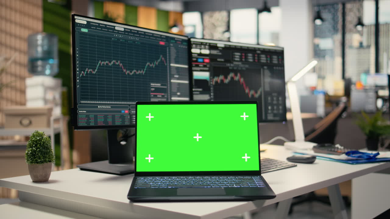 Close up of mockup laptop in forex trading firm office used for stock exchange