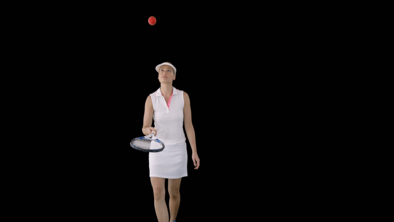 Tennis woman juggling with a tennis ball 