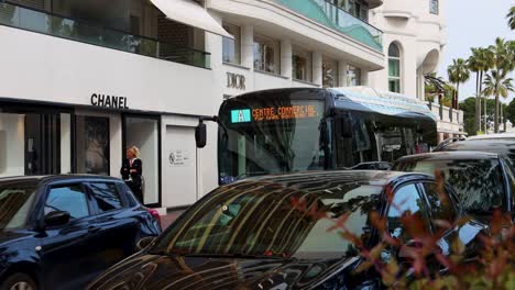 street traffic by chanel and dior luxury clothing stores in cannes, france. static shot