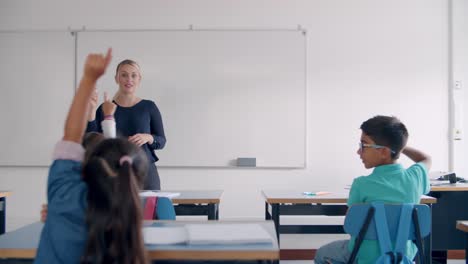 primary school teacher interacting with pupils