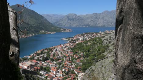 Kotor-Bay,-town,-mountains-and-sea,-forward-crane-shot,-Montenegro