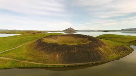 enjoy a breathtaking aerial journey over skútustaðagígar, revealing the intricate patterns and natural beauty that define this iconic icelandic landmark.